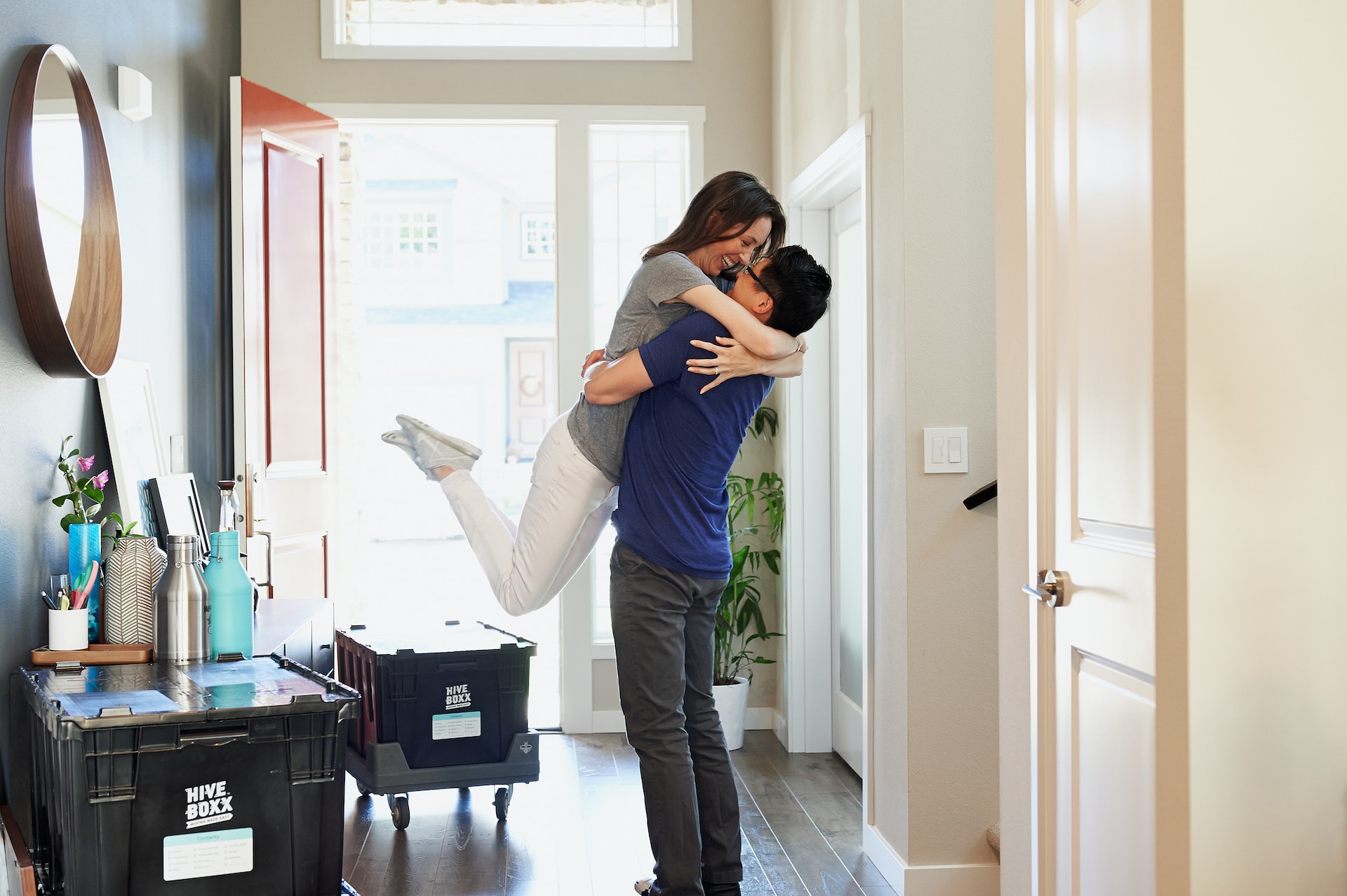 A couple hugging with boxes around them